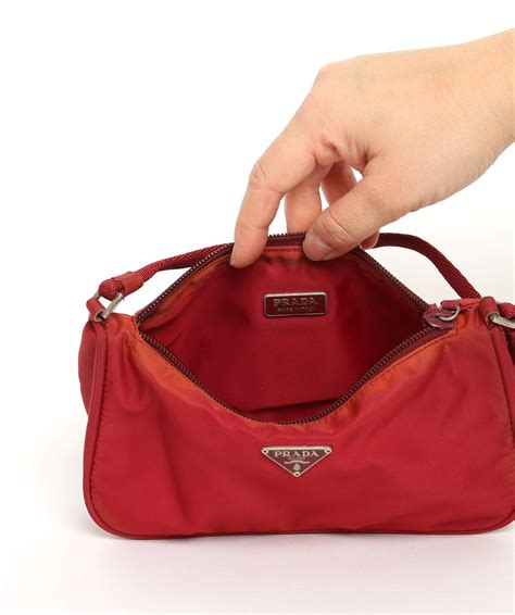 prada nylon pouch red|Prada beige nylon bag.